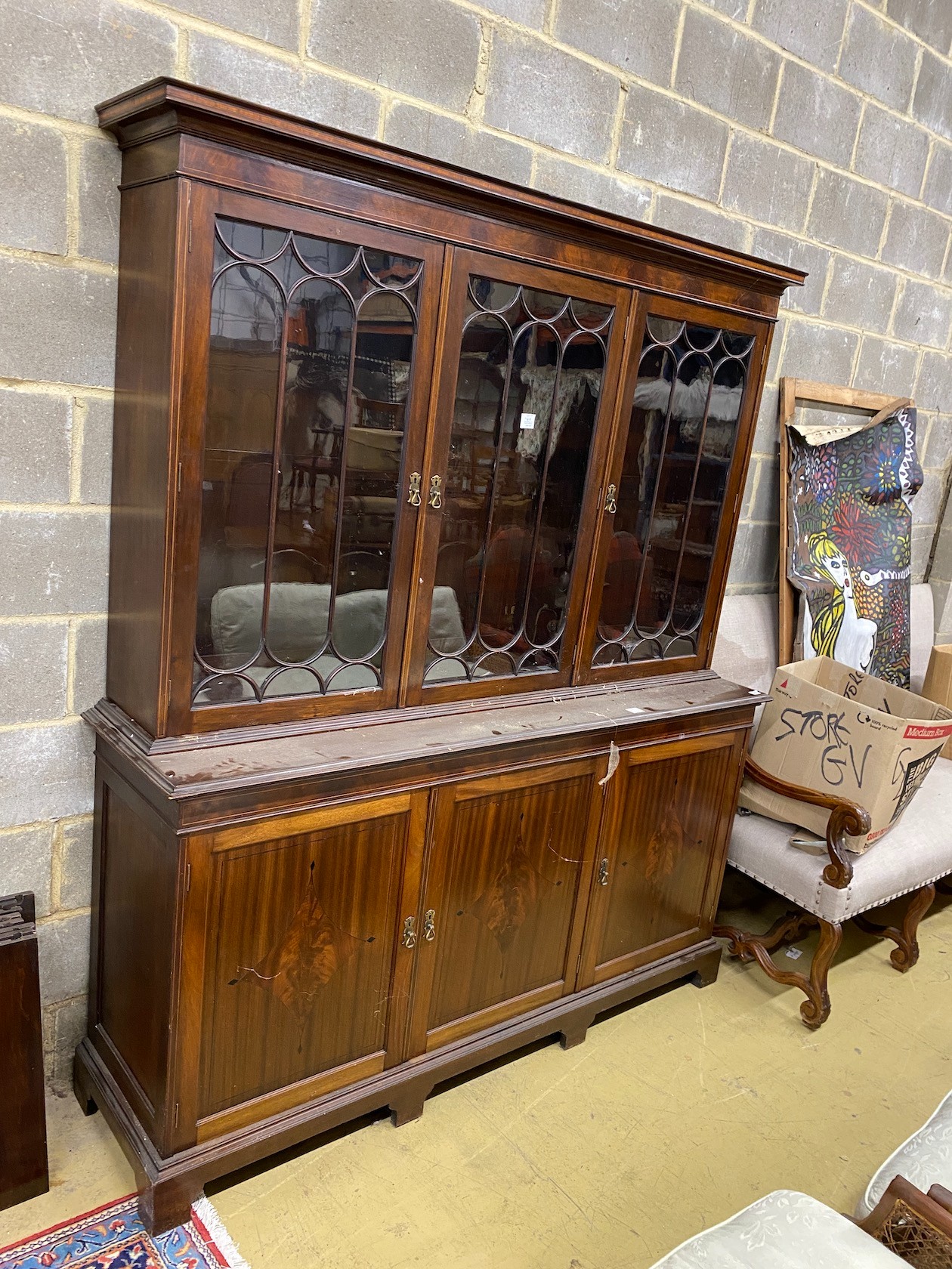 A reproduction George III style mahogany glazed library bookcase, length 182cm, depth 48cm, height 212cm